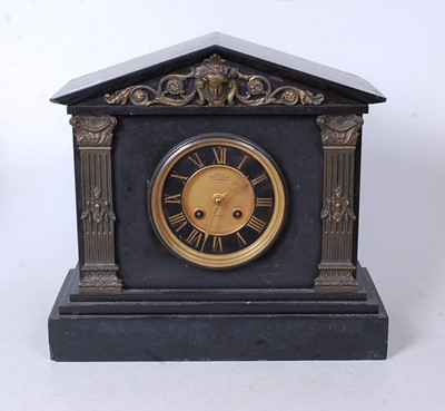 Lot 127 - A late Victorian black slate mantel clock, of...