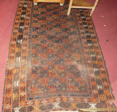 Lot 1154 - A Persian woollen brown ground Bokhara rug...