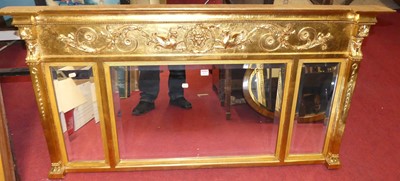 Lot 1076 - A reproduction gilt composition overmantel...