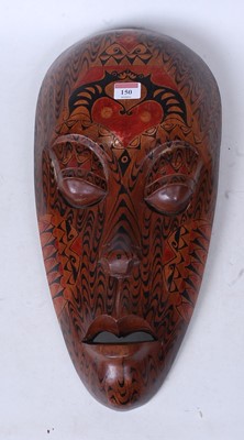 Lot 150 - An African souvenir wear mask of elongated...