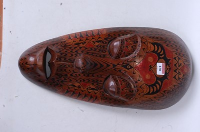 Lot 150 - An African souvenir wear mask of elongated...