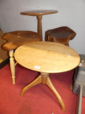 Lot 1092 - An antique pine low tripod table; together...