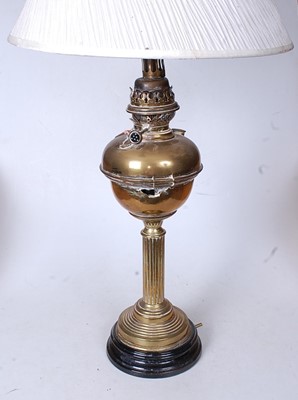 Lot 168 - An early 20th century brass pedestal oil lamp,...