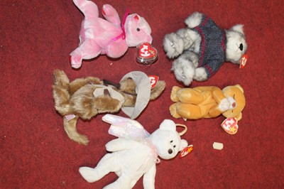 Lot 187 - Two boxes of soft toys and dolls, to include a...