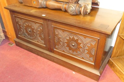 Lot 1174 - A walnut low double door side cupboard having...