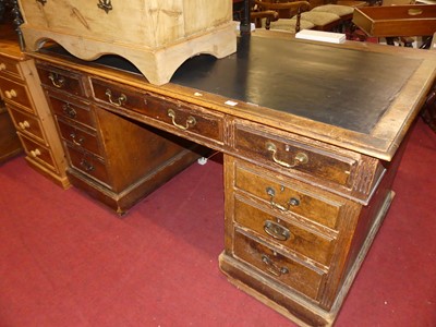 Lot 1252 - A late Victorian oak and rexine inset twin...