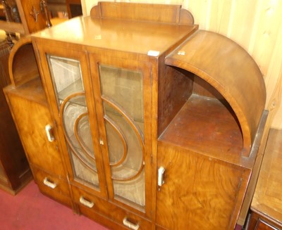 Lot 1258 - An Art Deco figured walnut ledgeback display...