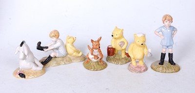 Lot 249 - A collection of six Royal Doulton Winnie the...