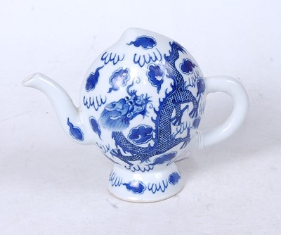 Lot 257 - A Chinese export blue and white teapot,...