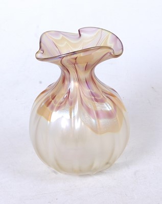 Lot 259 - A Loetz style iridescent glass vase, the...