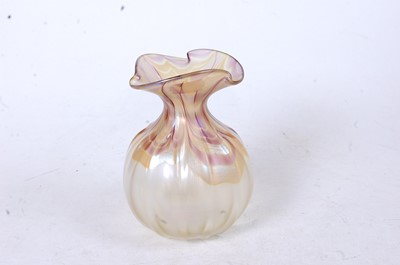 Lot 259 - A Loetz style iridescent glass vase, the...