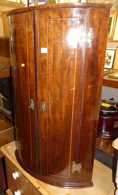 Lot 1228 - A 19th century mahogany bowfront double door...