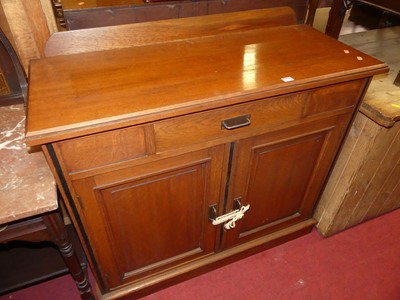 Lot 1238 - An Edwardian oak ledgeback double door side...