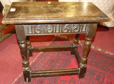 Lot 1293 - A joined and relief carved oak joint stool,...