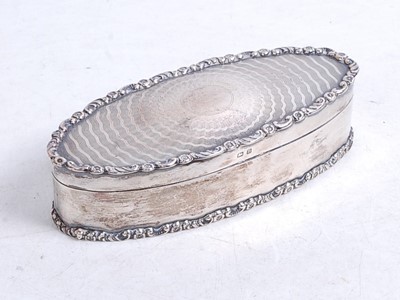 Lot 320 - A George V silver trinket box, of oval form,...