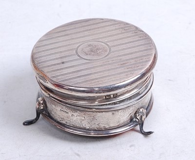 Lot 322 - A George V silver trinket box, of circular...