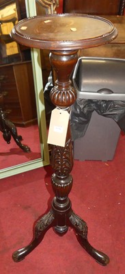 Lot 1350 - A floral carved mahogany pedestal plant stand,...