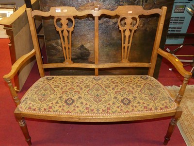 Lot 1327 - An Edwardian beech splatback two seater salon...