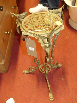 Lot 1377 - A cast pierced brass jardiniere stand, height...