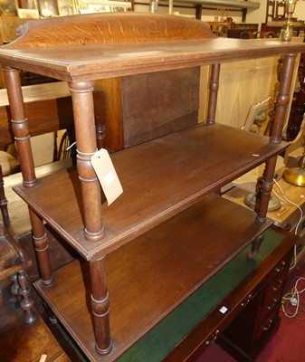 Lot 1379 - A circa 1900 oak three-tier buffet, having...