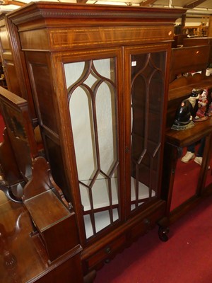 Lot 1383 - A mahogany and inlaid double door glazed china...