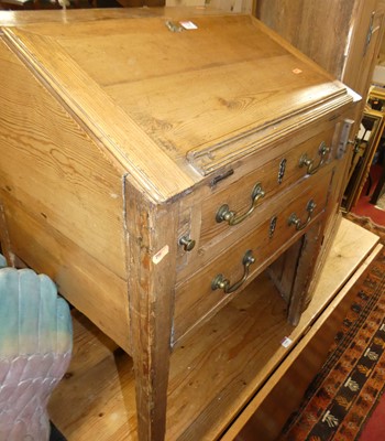 Lot 1399 - A rustic pine slopefront desk, having a hinged...