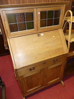 Lot 1409 - An early 20th century beech squat bureau...