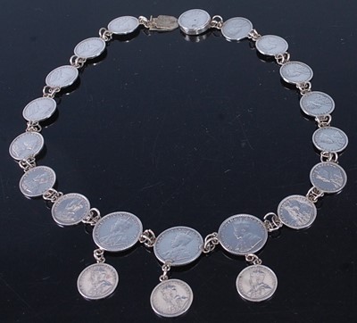 Lot 413 - A white metal coin bracelet made up of early...