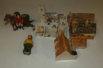 Lot 1559 - A small box of ceramic model churches, houses,...