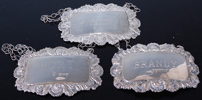 Lot 432 - A set of three modern silver decanter collars,...