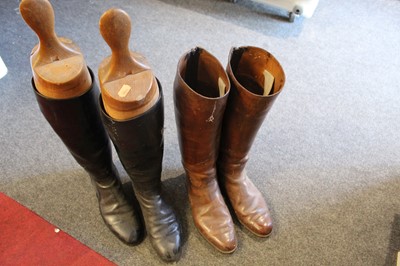 Lot 615 - A pair of brown leather knee-high riding boots,...