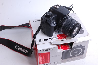 Lot 513 - A Canon EOS 1000D digital camera, boxed, with...