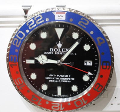 Lot 666 - A Rolex style Pepsi dial wall clock, with...