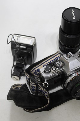 Lot 545 - An Olympus OM10 camera in camera bag with...