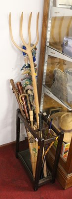 Lot 551 - A collection of various walking sticks, riding...