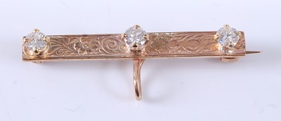 Lot 2605 - A 9ct yellow gold diamond bar brooch,...