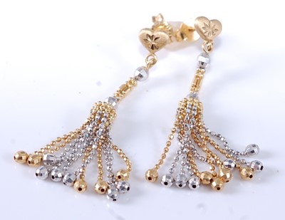Lot 2616 - A pair of yellow and white metal beaded tassel...