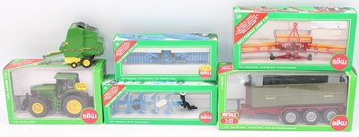 Lot 1502 - 1 box containing 5 Siku boxed Farm related...