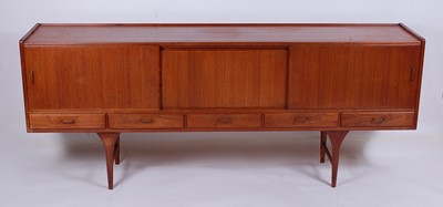 Lot 521 - A 1960s teak long sideboard, having integral...