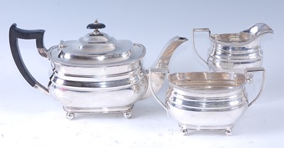 Lot 2143 - A silver three-piece tea set, comprising...