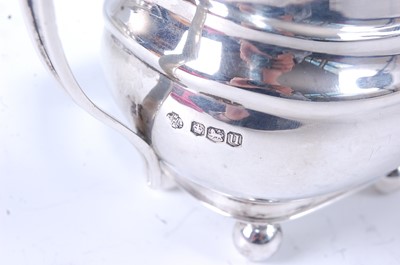 Lot 2143 - A silver three-piece tea set, comprising...