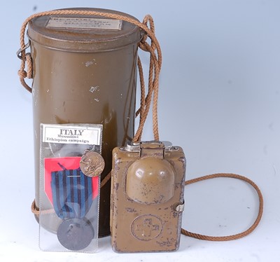 Lot 40 - A WW II signal lamp, the front with hinged...