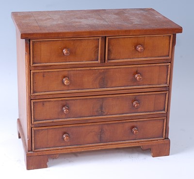 Lot 2246 - An apprentice piece type walnut chest in the...