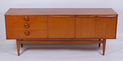 Lot 528 - A 1960s teak long sideboard, having three...