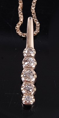 Lot 2624 - A yellow metal diamond five-stone bar pendant,...