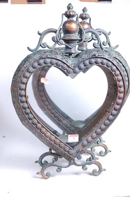 Lot 9 - A pair of modern copper-effect heart shaped...