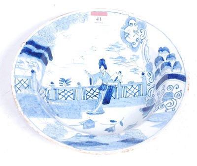 Lot 41 - An 18th century tin-glazed dish, decorated in...