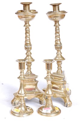 Lot 49 - A pair of Victorian brass table candlesticks,...