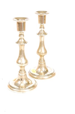 Lot 49 - A pair of Victorian brass table candlesticks,...