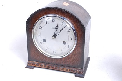 Lot 19 - A 1930s bakelite cased eight-day mantel clock,...